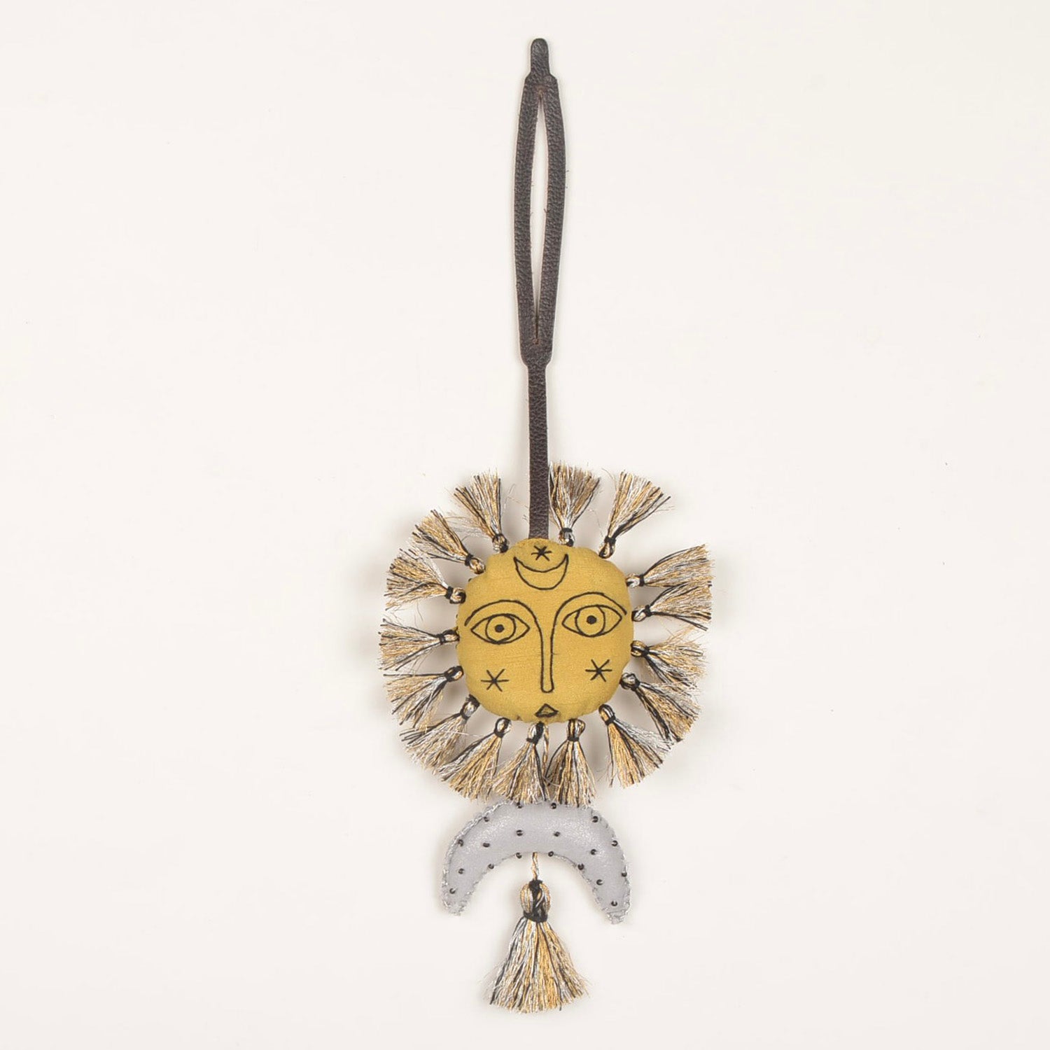 Handcrafted Bag Charm BC_Helios_01 featuring unique fabric design and stylish leather strap, made by Hazara artisans.